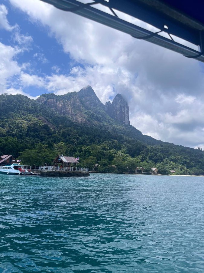 First sight of the Dragon's Horns — arriving at Mukut by boat.